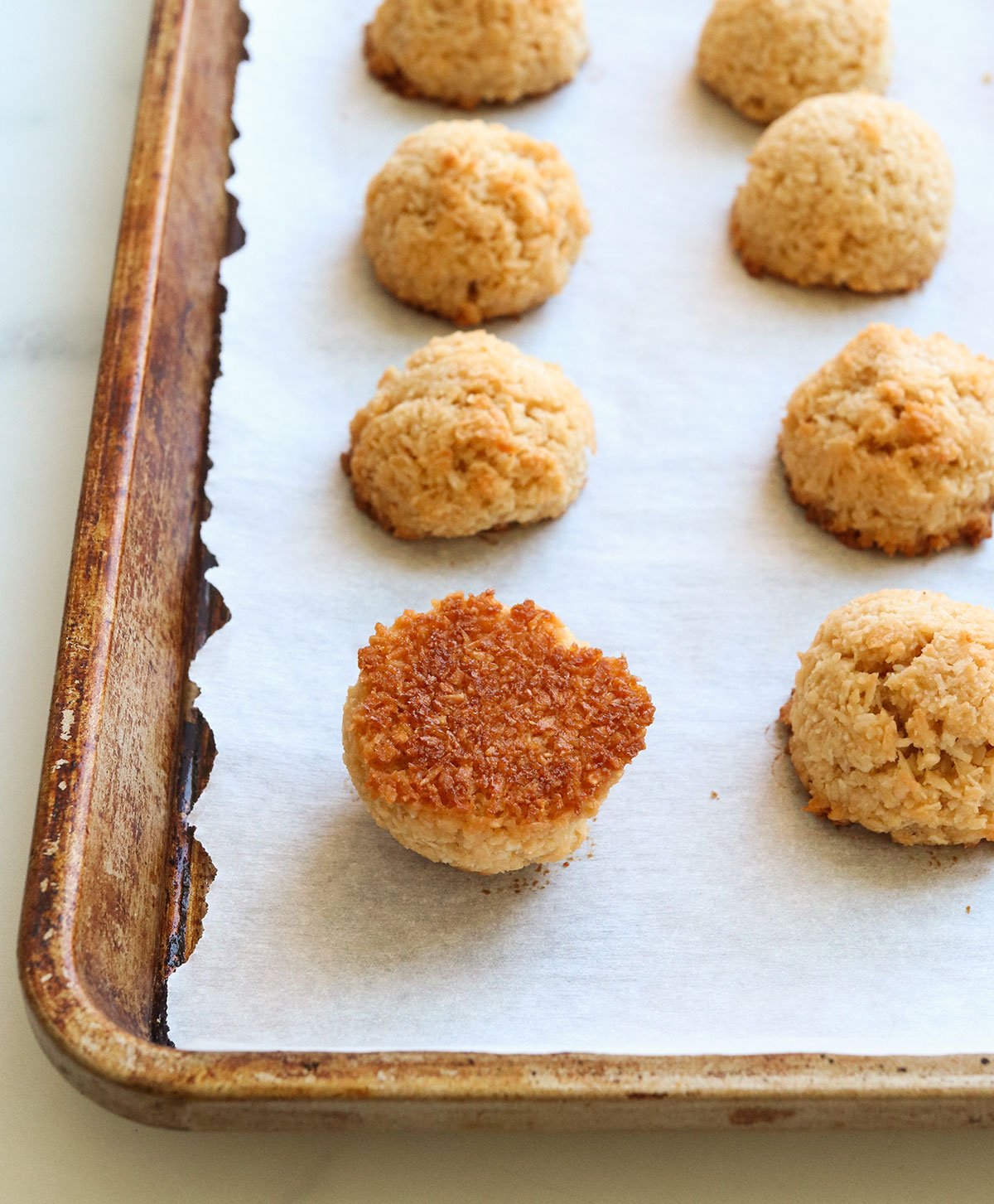 bottom of macaroon flipped over to show golden brown bottom.