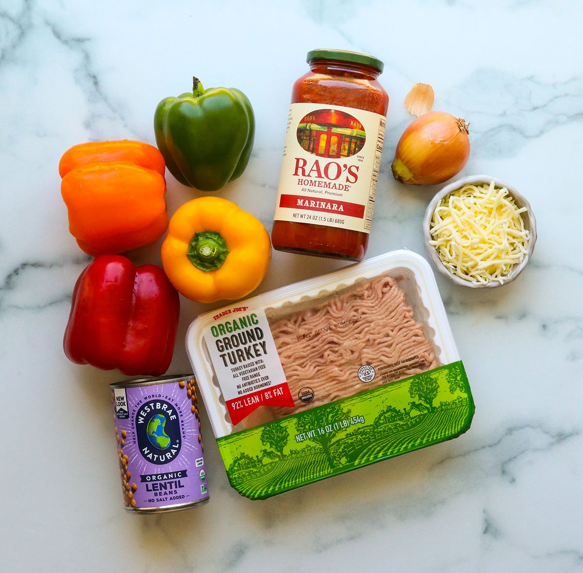 ground turkey stuffed pepper ingredients laying on a marble surface.