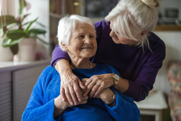 Woman hugging her elderly mother Woman hugging her elderly mother seniors  stock pictures, royalty-free photos & images