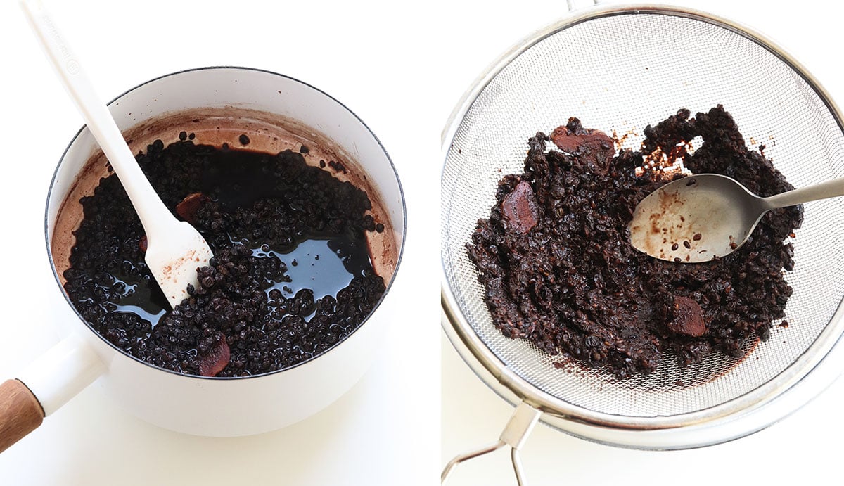 elderberries cooked down in saucepan and strained with a fine mesh strainer over bowl.