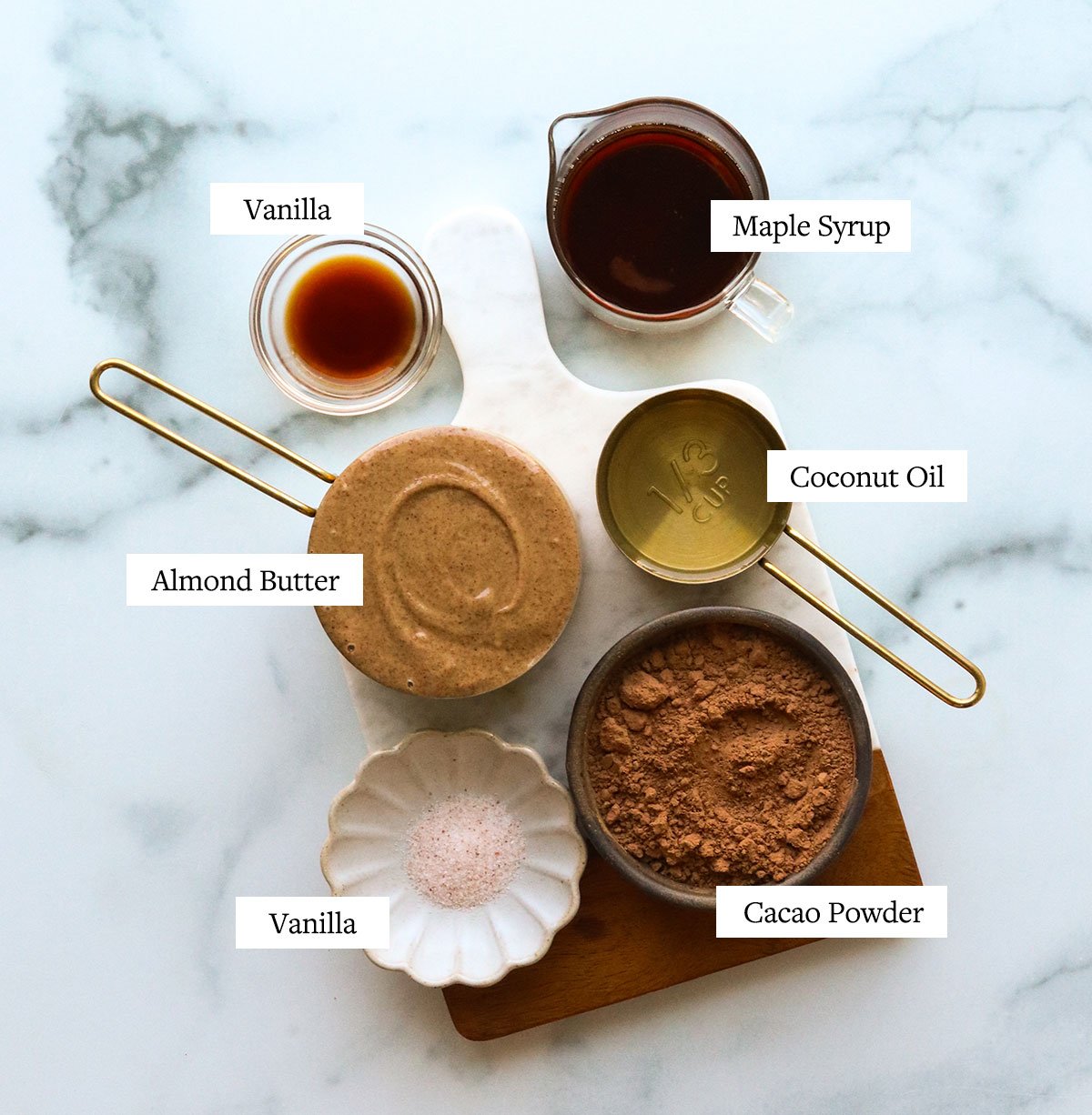 vegan fudge ingredients arranged on a marble cutting board.