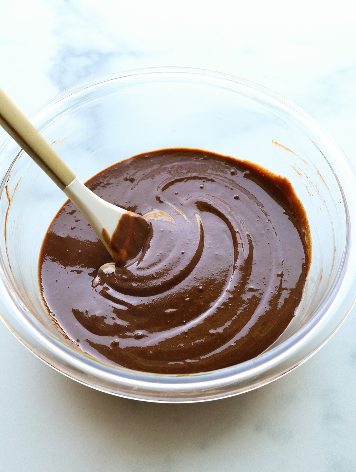 vegan fudge mixed in glass bowl.